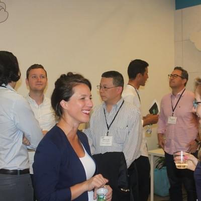 Attendees talking and laughing during a networking reception